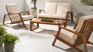 Isham 4 - Person Seating Group with Cushions in a patio space