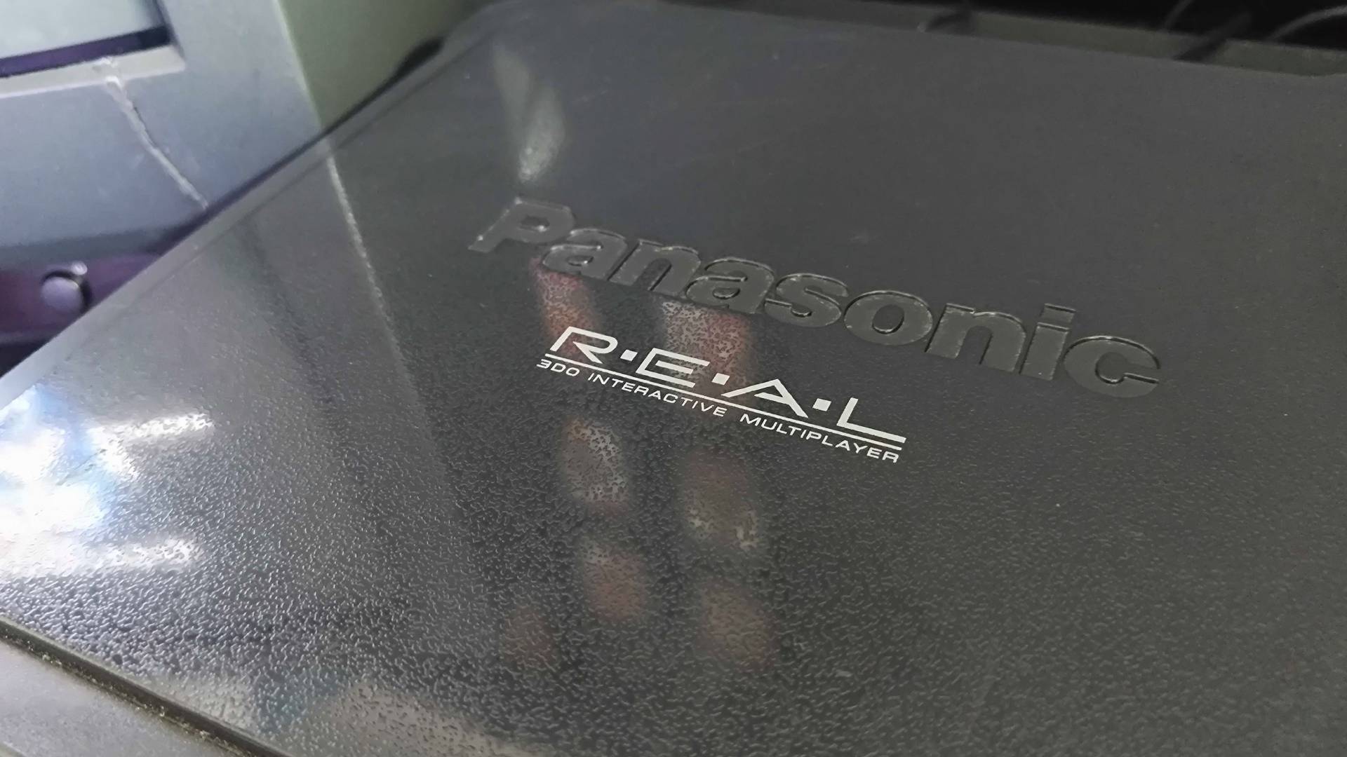 Close up of Panasonic 3DO console top logo.