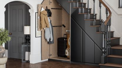 elegant hallway with dark grey staircase, light wood flooring, and artwork on the walls