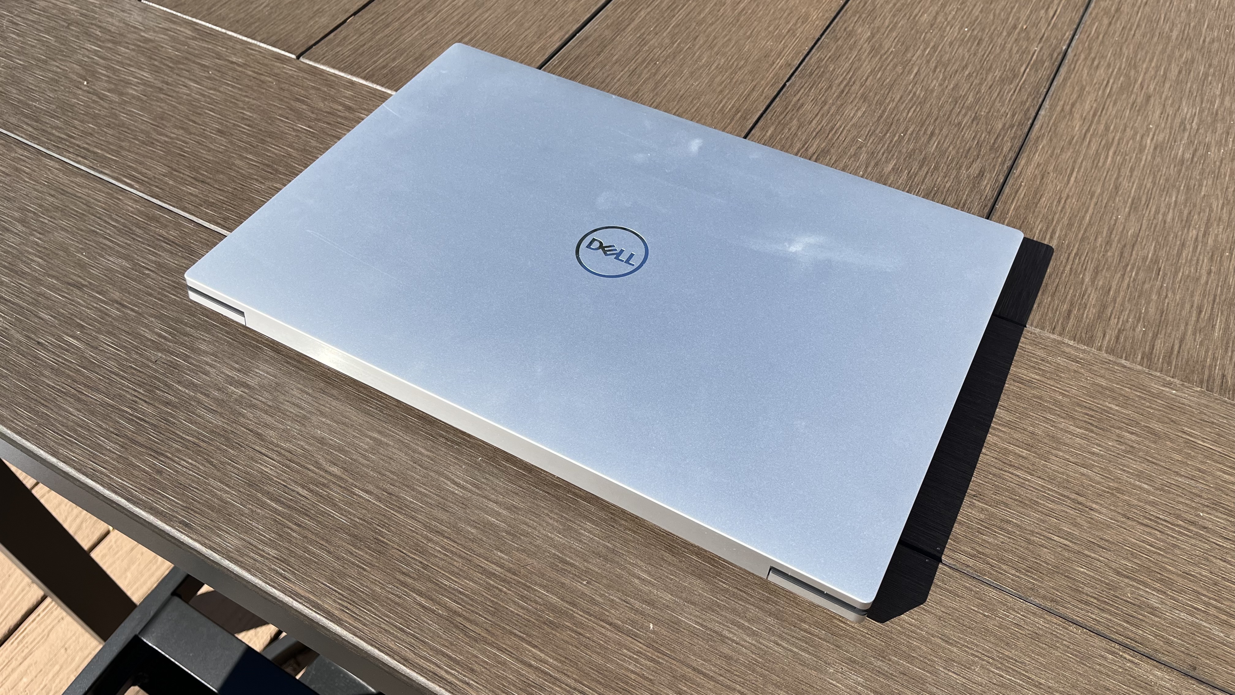 Dell XPS 17 laptop in use on a wooden desk