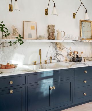 Blue kitchen with marble splashback