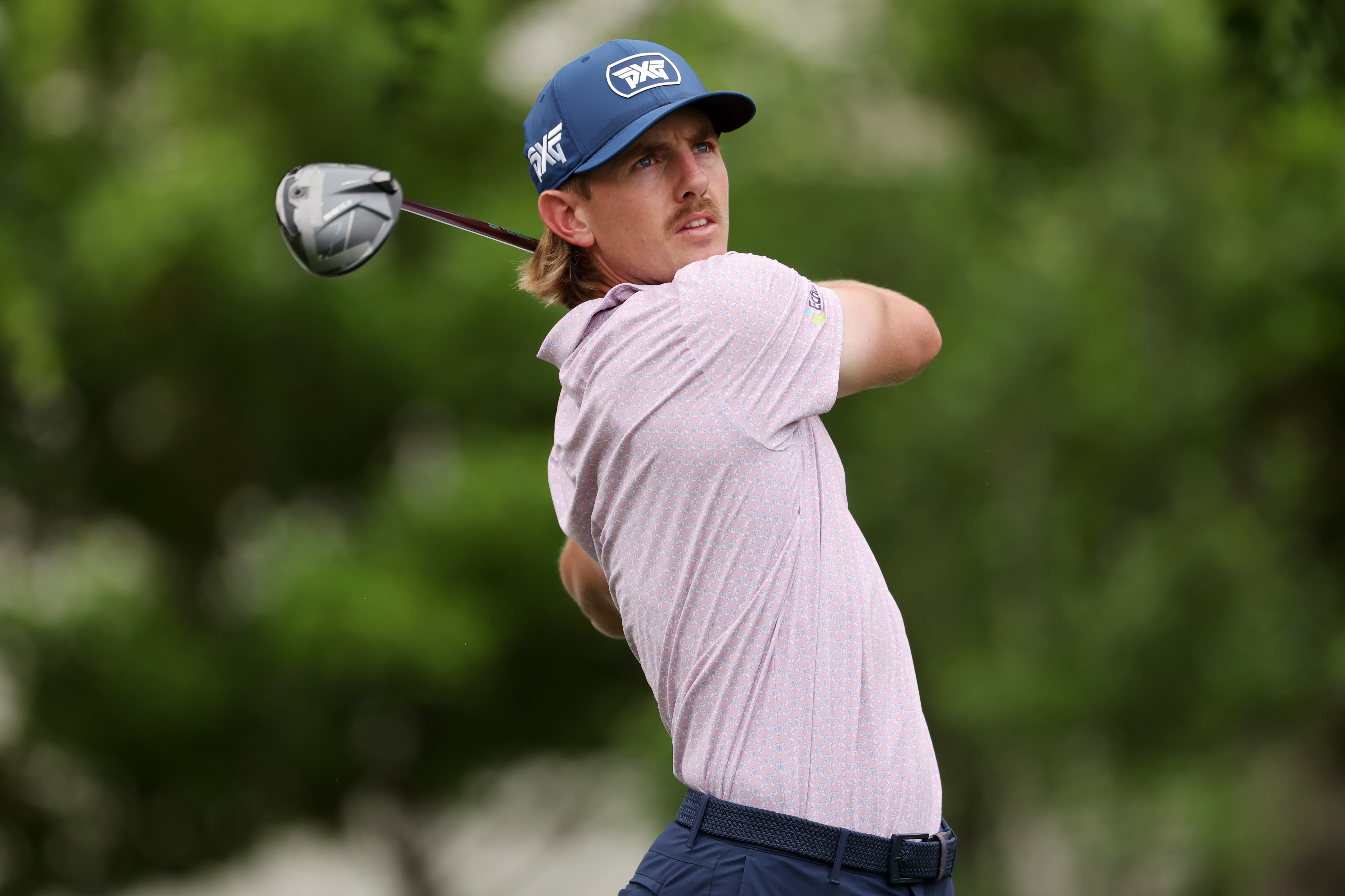Jake Knapp hits a tee shot and watches its flight