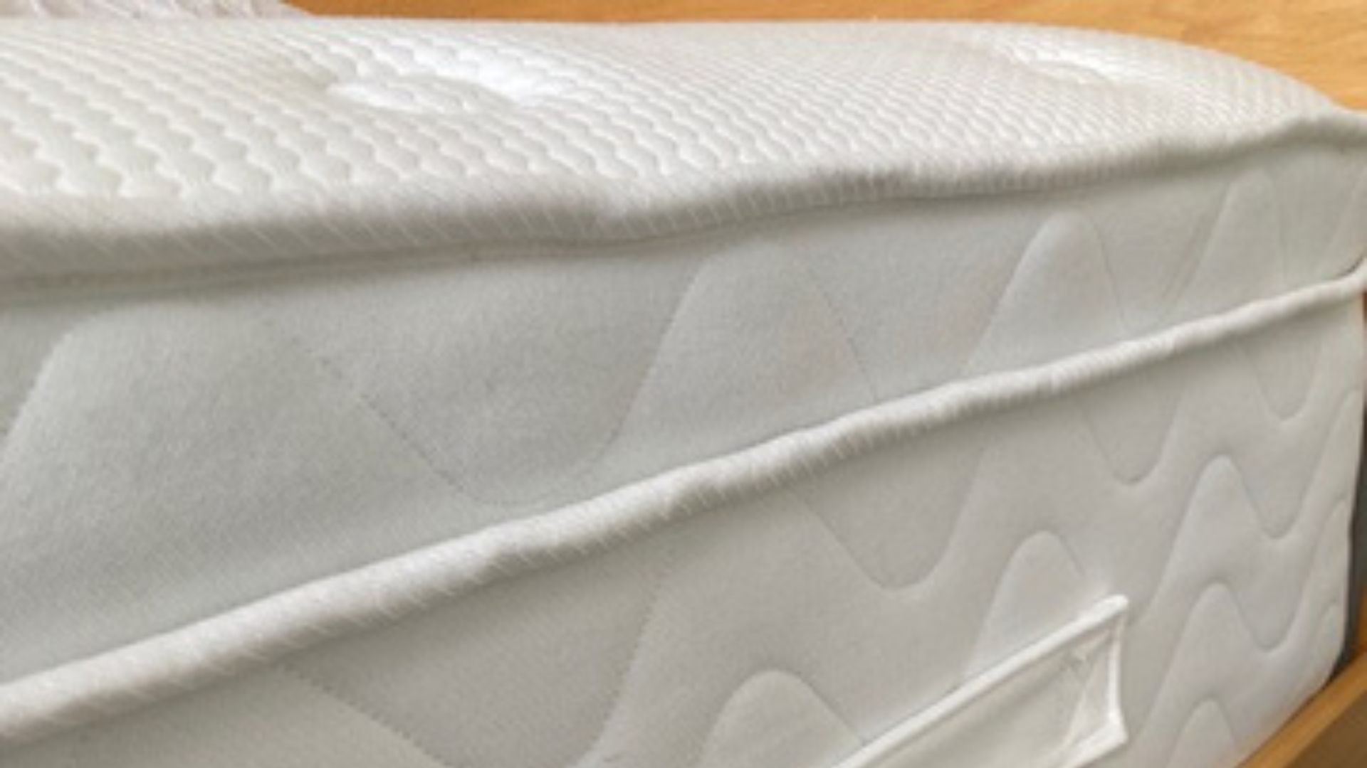 Evermore 1500 Pocket Spring Foam Hybrid Mattress in our tester, Linda's bedroom on a wooden bed frame