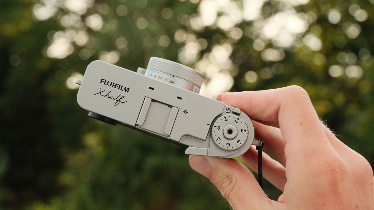 Fujifilm X Half camera held in a hand