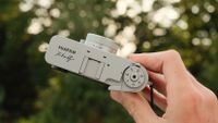 Fujifilm X Half camera held in a hand