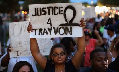 Supporters of Trayvon Martin assembled in front of the Seminole County Criminal Justice Center for the verdict to be announced in the George Zimmerman murder trial on July 13 in Sanford, Flor