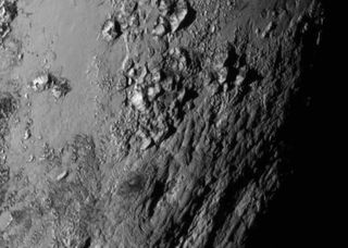 New Horizons provides the highest resolution image of Pluto ever seen as presented in a NASA press conference on July 15, 2015, at the Johns Hopkins University Applied Physics Laboratory, Laurel, Maryland.
