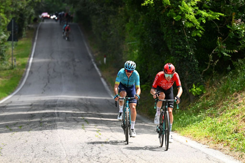 FANO ITALY MAY 16 LR Christian Scaroni of Italy and Astana Qazaqstan Team and Ewen Costiou of France and Team Arkea BB Hotels compete in the chase group during the 107th Giro dItalia 2024 Stage 12 a 193km stage from Martinsicuro to Fano UCIWT on May 16 2024 in Fano Italy Photo by Tim de WaeleGetty Images