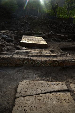 Some of the tombstones of Portuguese slavers revealed by the excavation.