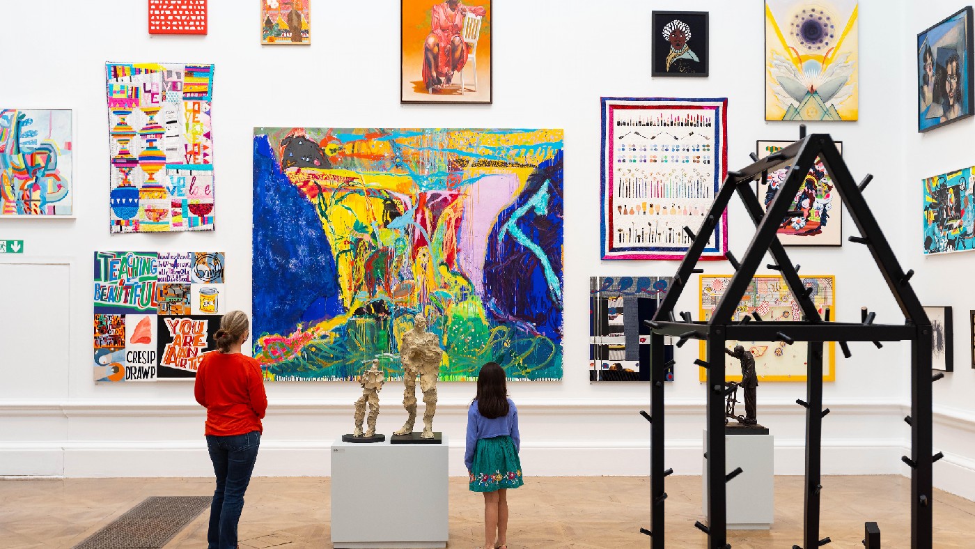 Summer Exhibition visitors looking at the collection