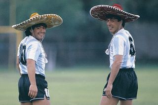 Diego Maradona and Daniel Passarella pose in sombreros at Argentina's training camp ahead of the 1986 World Cup in Mexico in an image for Argentine magazine El Gráfico.