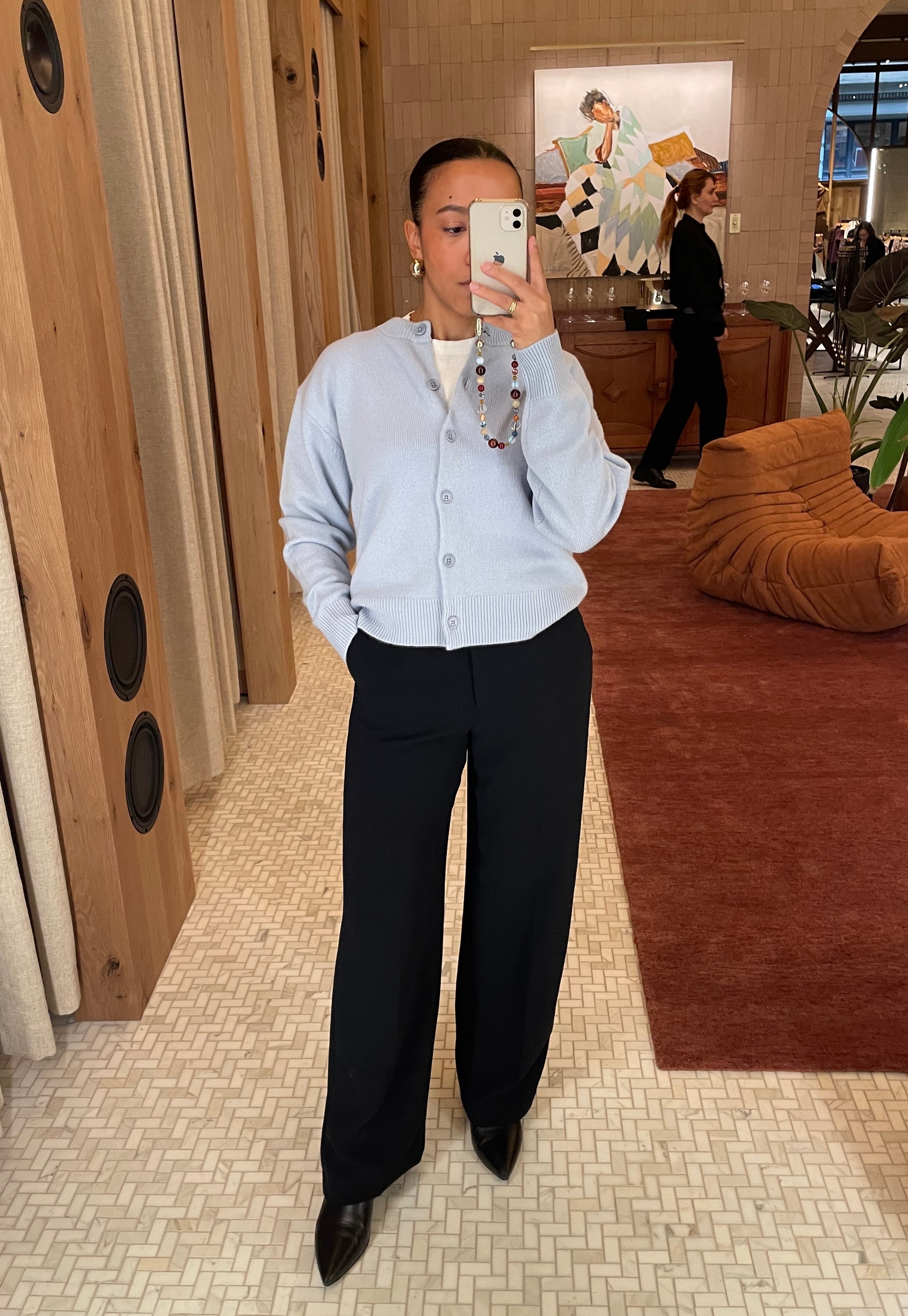 Lauren Tappan wearing a cool blue sweater from Aritzia