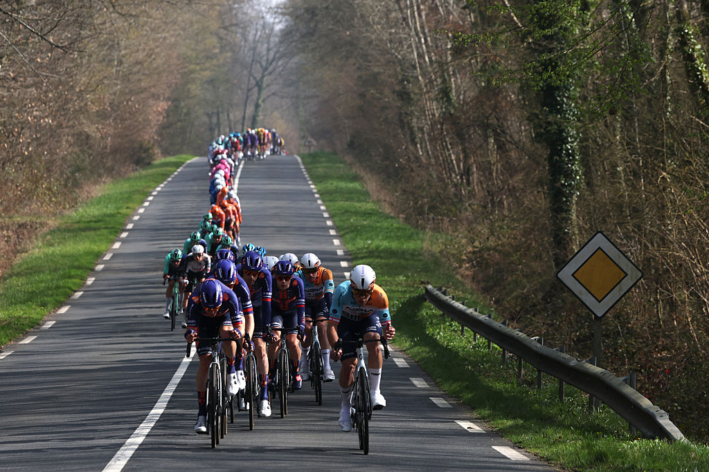 The pack rides during the 1st stage of the Paris-Nice cycling race, 170.9 km between Ach&amp;egrave;res and Carri&amp;egrave;res-sous-Poissy, on March 8, 2026. (Photo by Anne-Christine POUJOULAT / AFP)