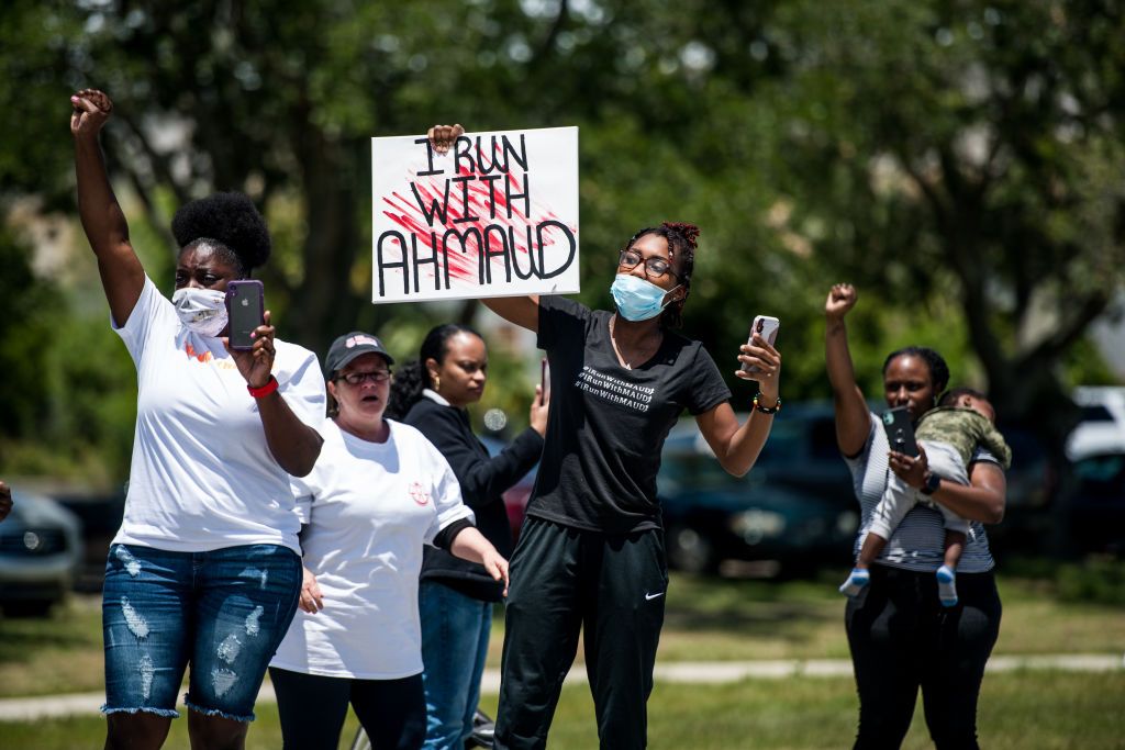 Protesters share their support for Ahmaud Arbery.