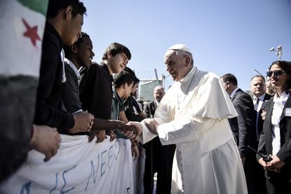 Pope Francis greets migrants in Greece