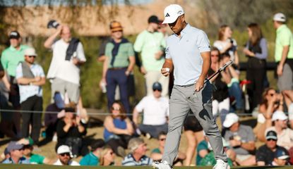 Schauffele walks on while holding his golf ball in his hand