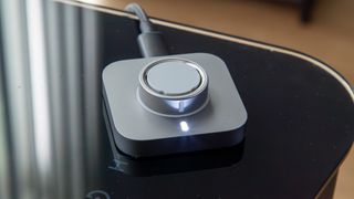 The Oura Ring 4 on its charging dock