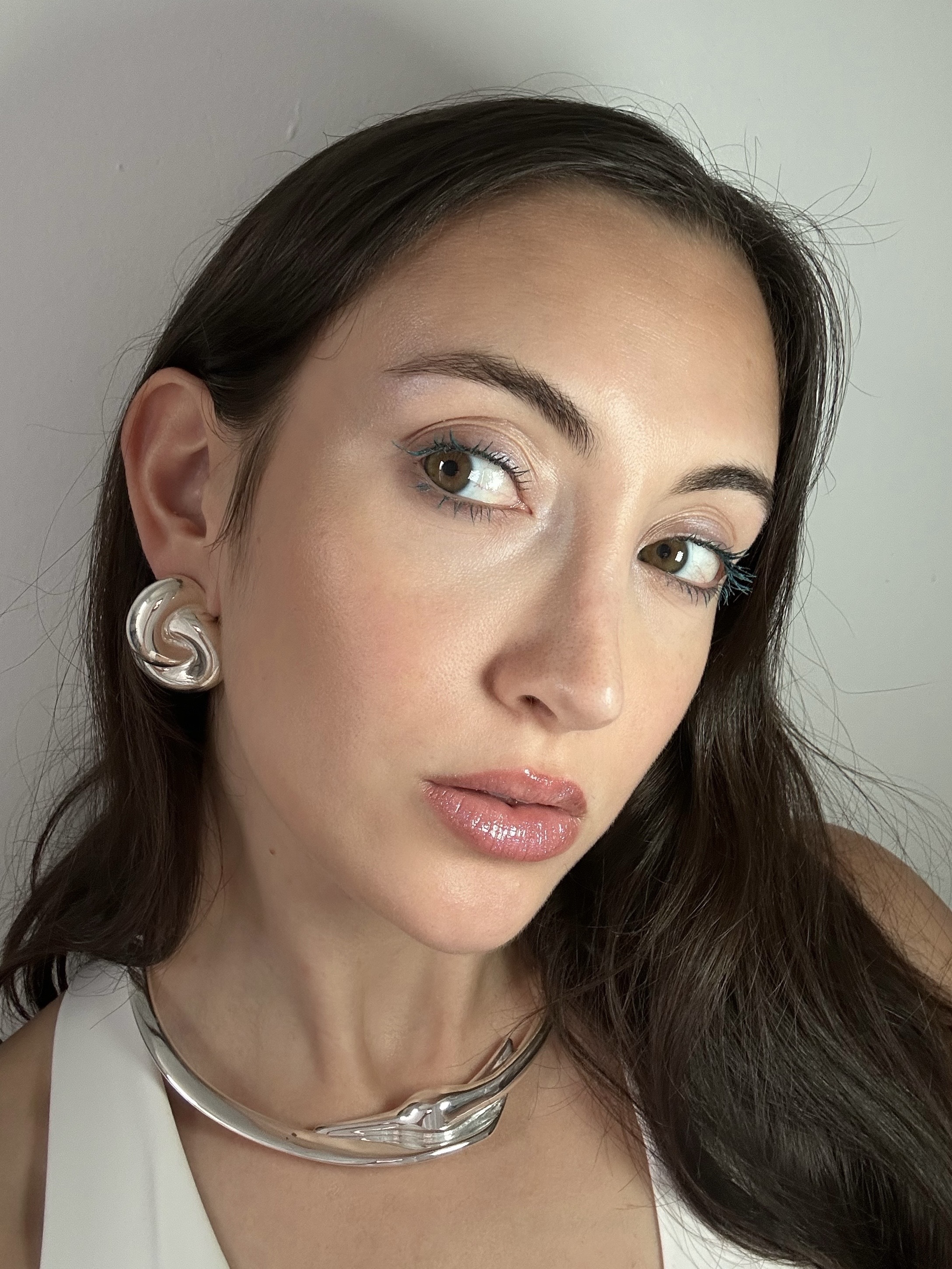 Alyssa Brascia wearing the Half Magic Eyelectric Extreme Lengthening Mascara in a turquoise shade.