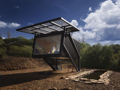 null small house, a raised steel and timber structure in the countryside that experiments as a proposal for climate resilient architecture