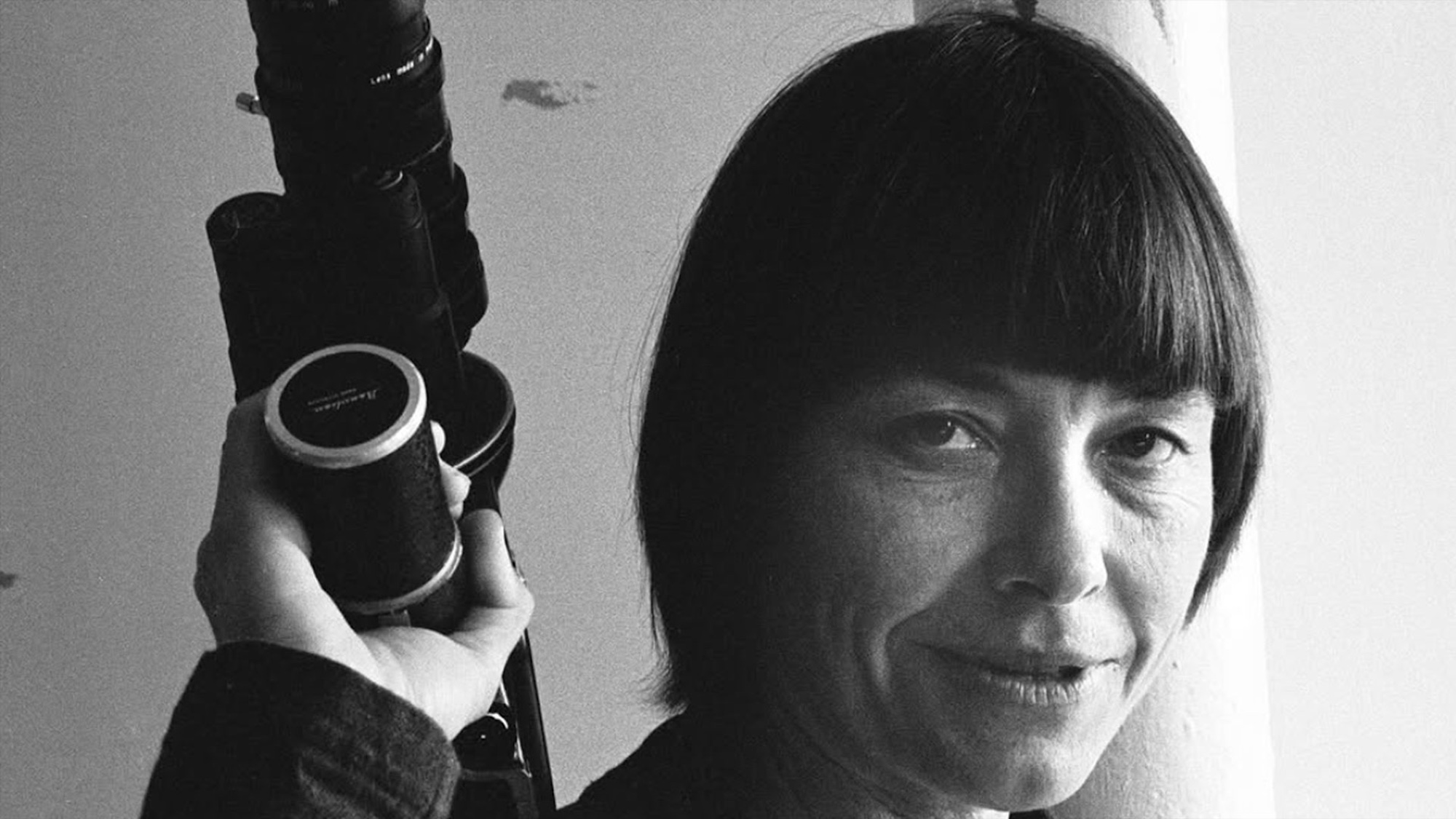 b&amp;amp;w photo of Barbara Hammer holding a camera