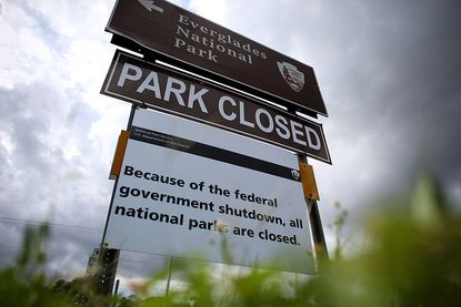  A sign near the entrance to the Everglades National Park is seen indicating it is closed on October 7, 2013 in Miami, Florida