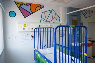 Hospital room with wall art designed by Supermundane