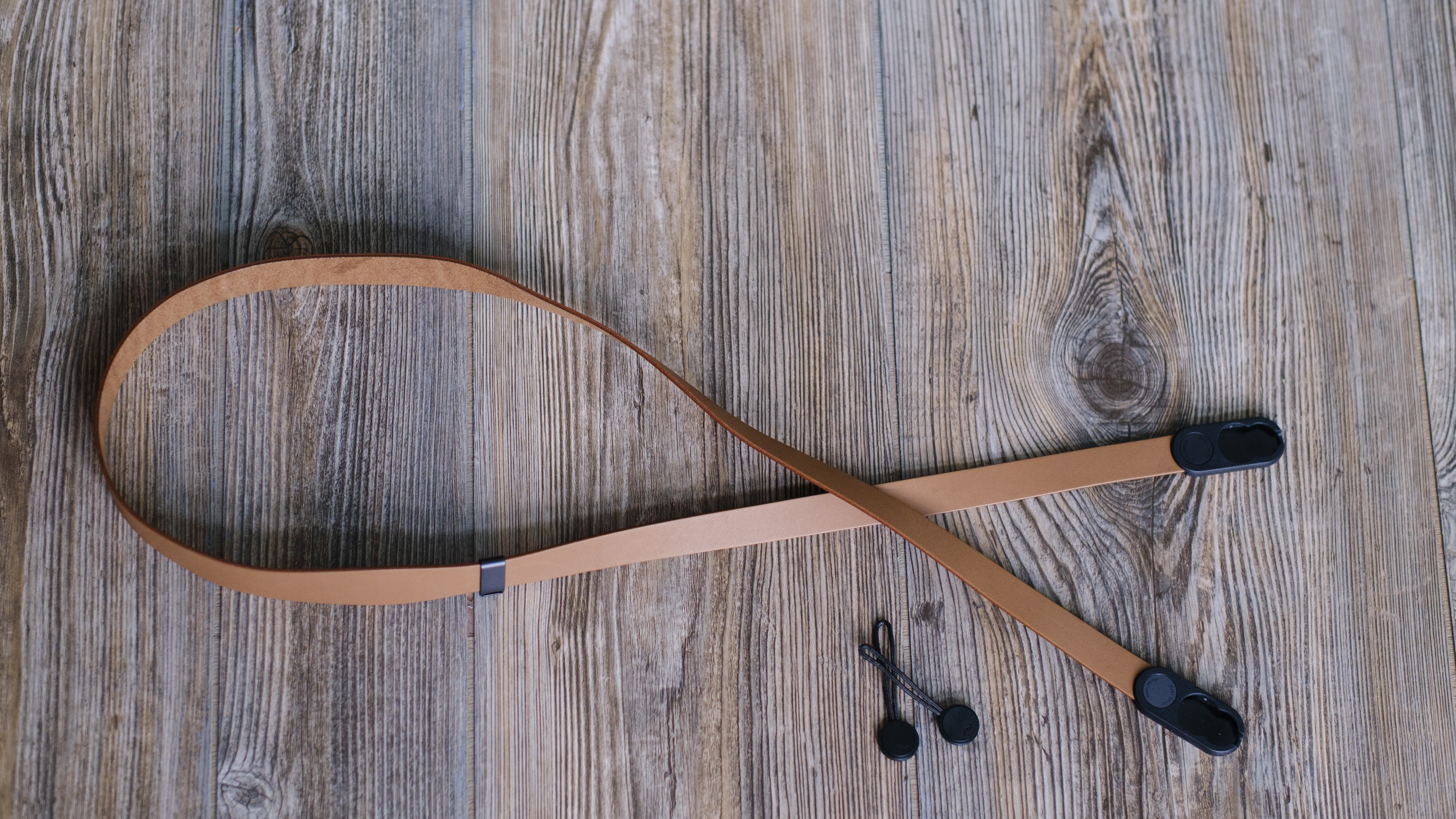 The Peak Design Form leather camera strap in the Amber color