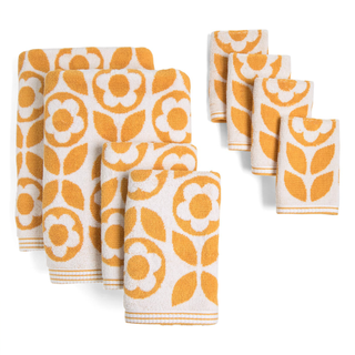 A set of white and orange daisy print bath towels
