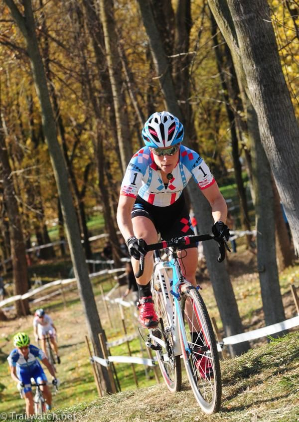 Katie Compton (Trek Cyclocross Collective) riding through the trees