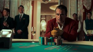 Colin Farrell at a gambling table in Ballad of a Small Player