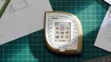 "Mango phone" (Nokia 7600), surrounded by designer Tej Chauhan's sketches