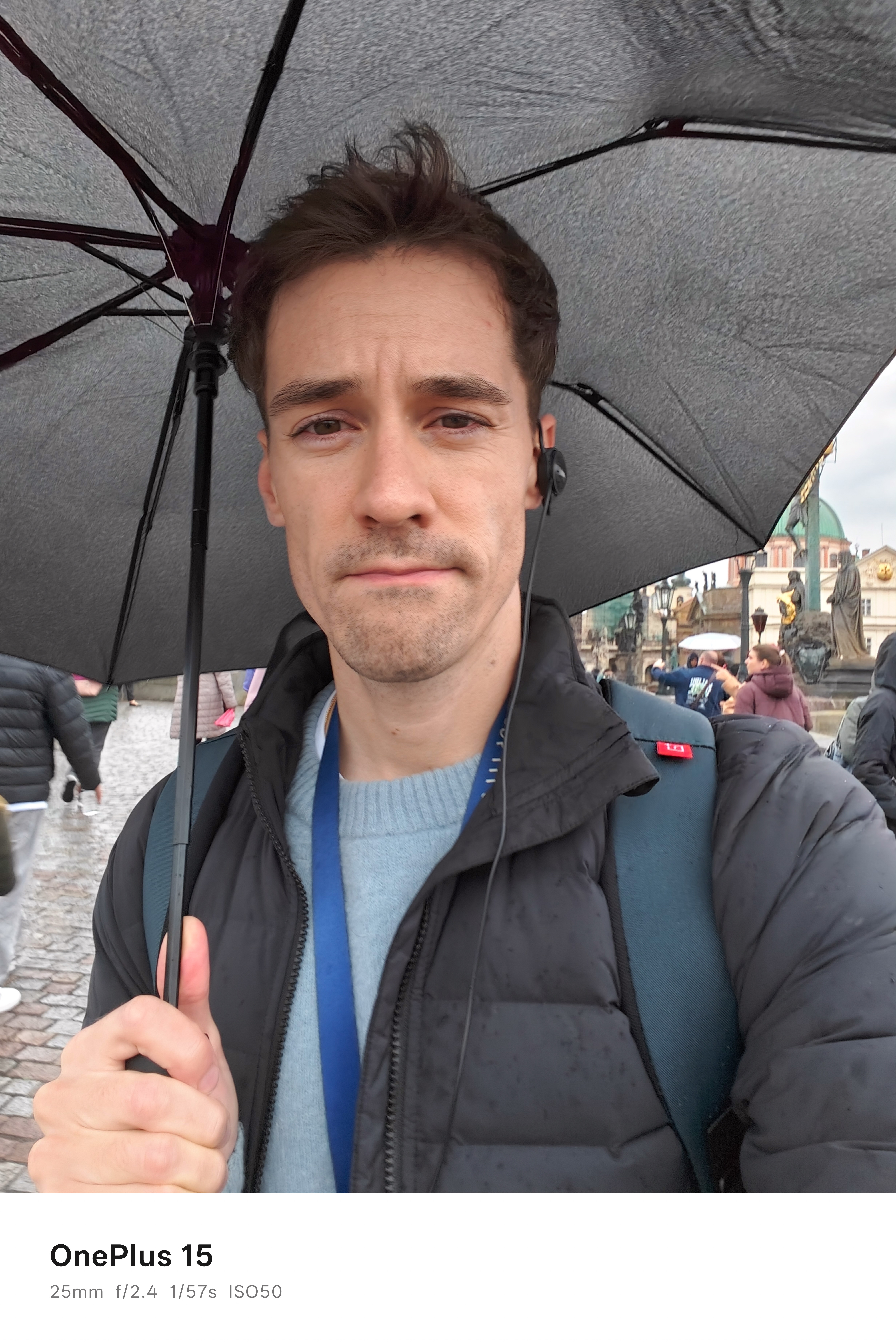 Selfie of digital camera world reviewer Gareth Bevan holding an umbrella
