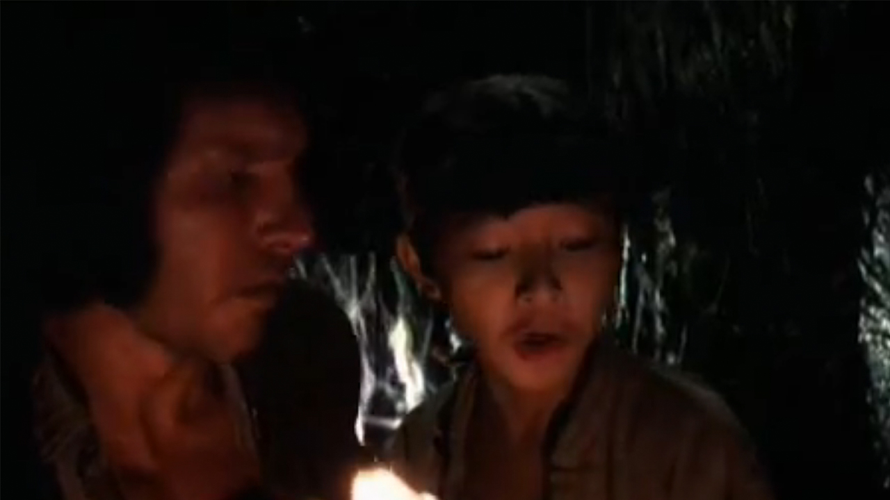 A close up of ke Huy Quan and Harrison Ford in Temple Of Doom