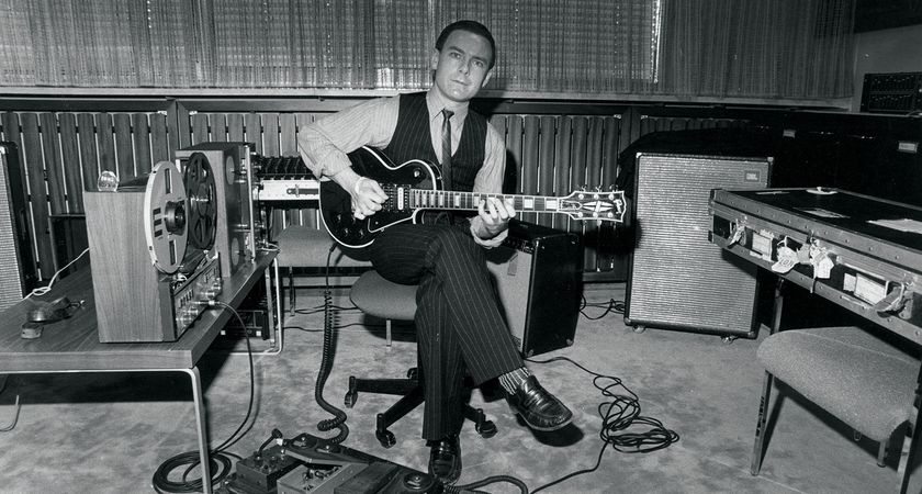 A black-and-white image of Robert Fripp playing his 1959 Gibson Les Paul Custom