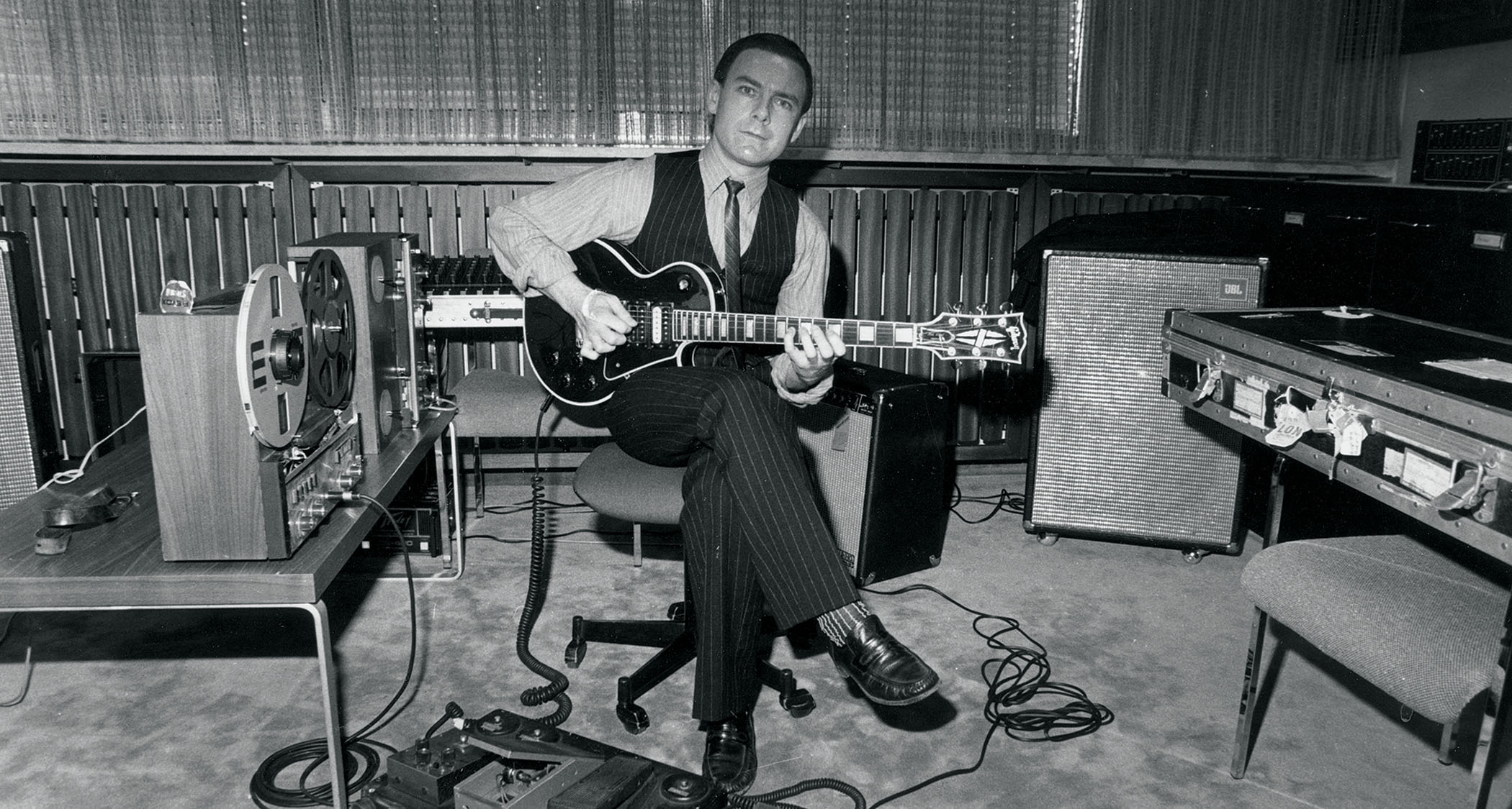 A black-and-white image of Robert Fripp playing his 1959 Gibson Les Paul Custom