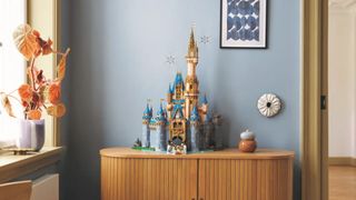 Lego Disney Castle, fully constructed, on a wooden surface