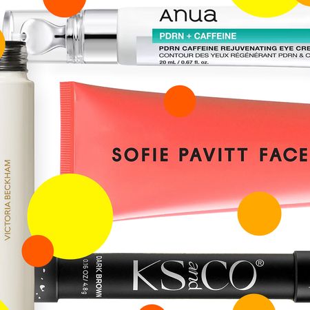 A collage of beauty products (tubes of creams, mascara, brow pencil) with polka dots all over them. 