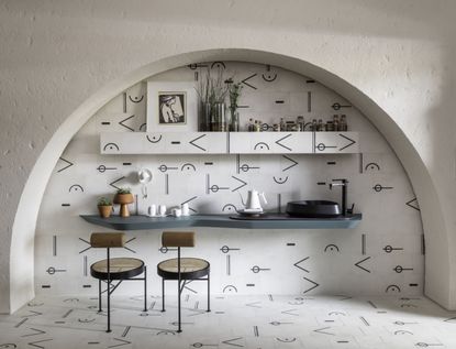 A kitchen space with hand-painted tiles