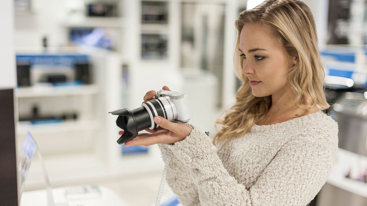 woman with camera finding one of the best ways to save money on astrophotography gear