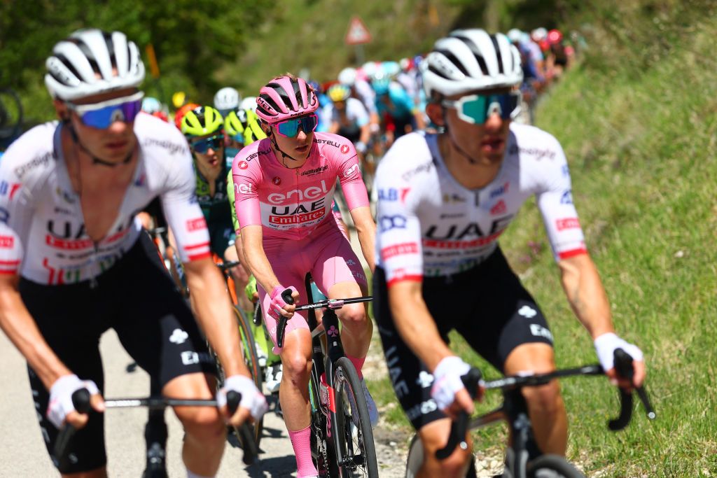 Pink jersey Team UAE's Slovenian rider Tadej Pogacar rides in the pack during the 8th stage of the 107th Giro d'Italia cycling race, 152km between Spoleto and Prati di Tivo, on May 11, 2024. (Photo by Luca Bettini / AFP)