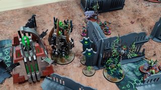 Necrons clash with Orks on the battlefield, using Warhammer 40,000 10th Edition rules