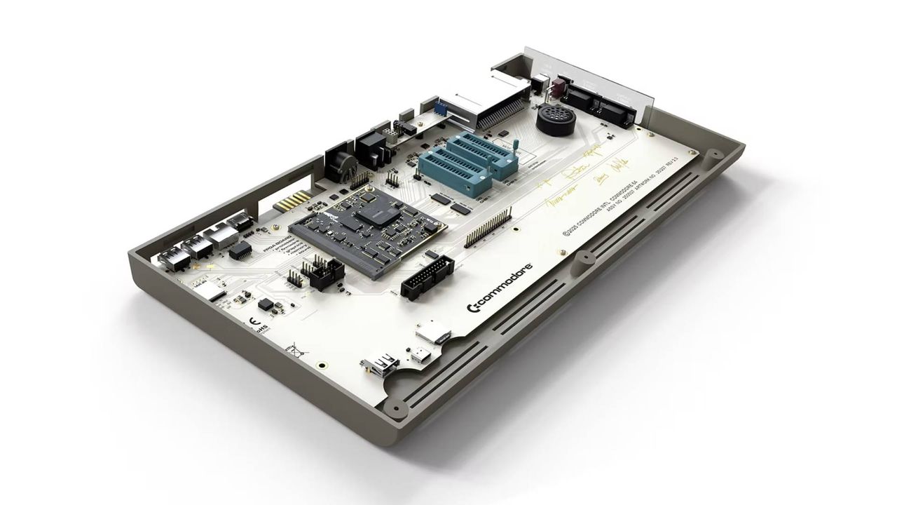 Inside view of Commodore 64 Ultimate with top removed and white main board showing.