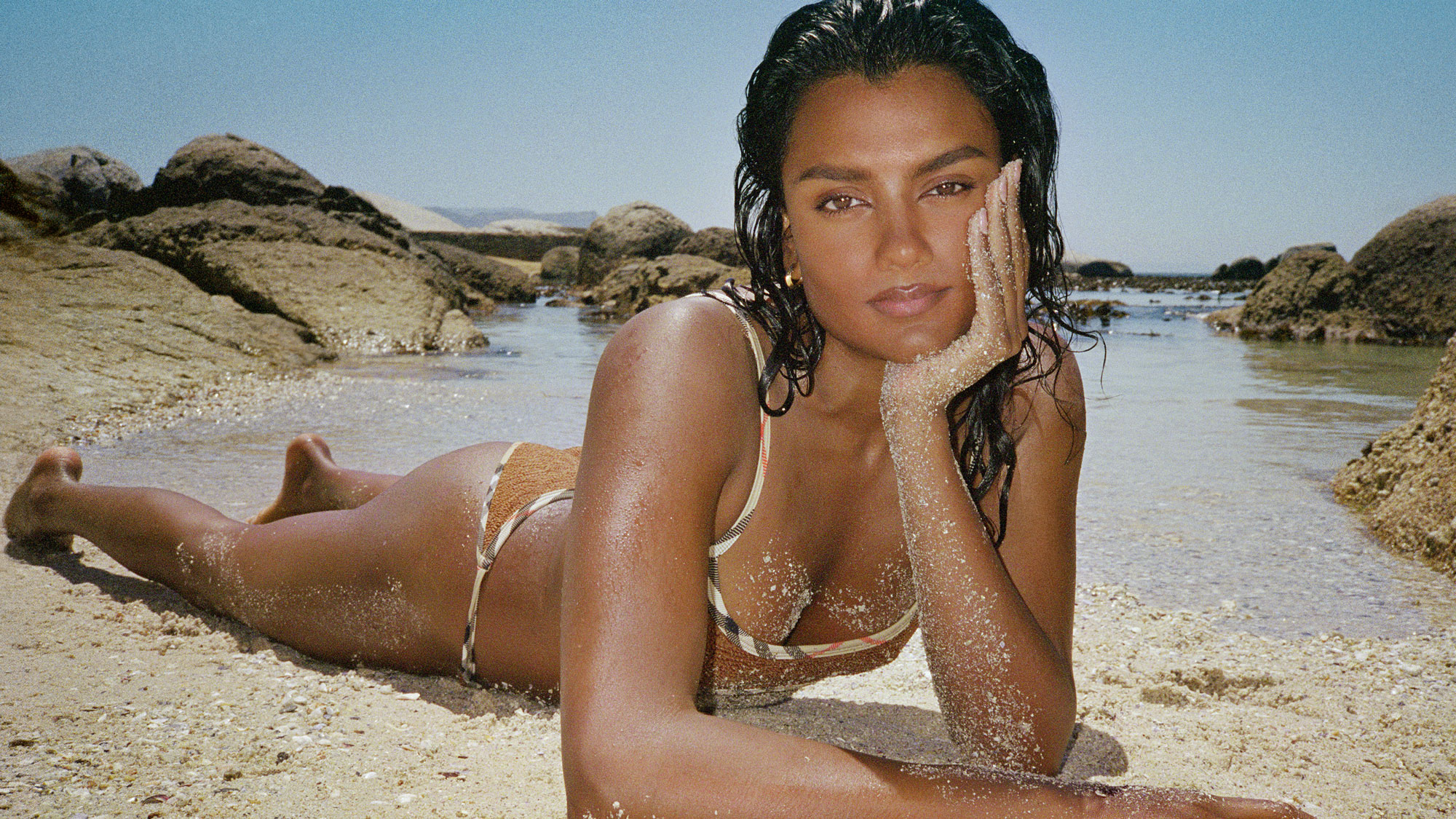 Simone Ashley wearing Hunza G x Burberry swimwear.
