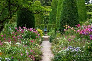 Pretty flower beds and clipped Yew trees