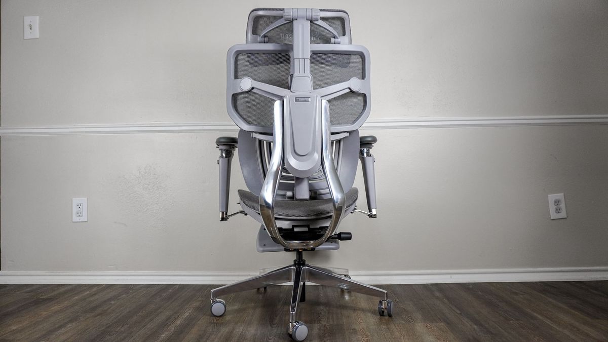 The Hinomi X1 seen from behind showing off its aluminum frame and backrest