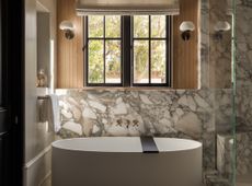 A bathroom with flattering lighting and natural materials