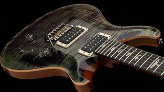 PRS Custom 24 in Aurora Borealis: a heavily figured maple top fringed in green and black