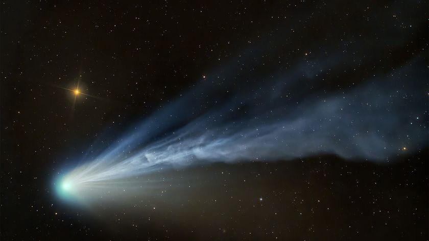 a blue and white wisp of light on a starry background