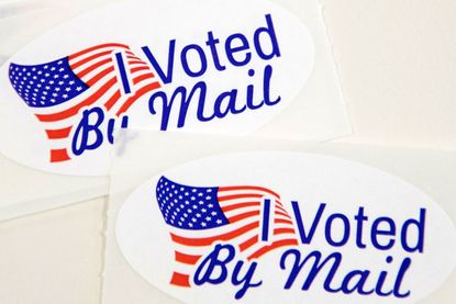 Stickers that say "I Voted By Mail."