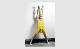 bald man in yellow outfit
